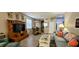 Bright living room with an open floor plan, tile floors, and stylish furnishings and decor at 834 Tremont Greens Ln # 137, Sun City Center, FL 33573
