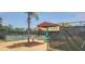 Kings Point Pickleball court with nets and shaded areas for comfortable play at 834 Tremont Greens Ln # 137, Sun City Center, FL 33573