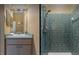 Split bathroom features a vanity and a shower tub combo with neutral tile at 8701 Lake Calm Ln, Odessa, FL 33556