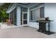 Outdoor kitchen area with stainless steel grill and back porch at 8701 Lake Calm Ln, Odessa, FL 33556