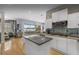 Modern kitchen showcasing a center island, stainless steel appliances, and abundant white cabinetry at 8701 Lake Calm Ln, Odessa, FL 33556
