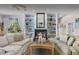 Inviting living room features a cozy fireplace, built-in shelving and hardwood floors at 8701 Lake Calm Ln, Odessa, FL 33556