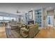 Open-concept living room with built-in shelves and lake views at 8701 Lake Calm Ln, Odessa, FL 33556