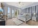 Serene main bedroom with calming tones, plush carpet, and tranquil lake views at 8701 Lake Calm Ln, Odessa, FL 33556
