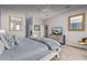 Bright main bedroom with plush carpet, soothing gray walls, and a comfy bed at 8701 Lake Calm Ln, Odessa, FL 33556