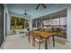Enclosed patio with plenty of seating and waterfront views of the lake at 8701 Lake Calm Ln, Odessa, FL 33556