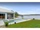 Poolside views of the lake from the backyard of this luxury real estate listing at 8701 Lake Calm Ln, Odessa, FL 33556