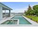 Large private in ground pool with spa and waterfront views in backyard at 8701 Lake Calm Ln, Odessa, FL 33556