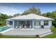Rear exterior with deck, in ground pool and screened in porch at 8701 Lake Calm Ln, Odessa, FL 33556