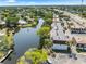 An aerial view shows the proximity to the river and the layout of the complex at 9130 Tudor Dr # M105, Tampa, FL 33615