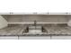 Close up of kitchen sink and countertops at 9130 Tudor Dr # M105, Tampa, FL 33615