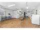 A well-equipped laundry room featuring several washers, dryers, and folding tables at 9130 Tudor Dr # M105, Tampa, FL 33615