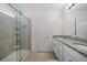 Bathroom features double sinks, granite countertops, and a glass-enclosed shower with tiled walls at 9647 Summers Cay Cir, Thonotosassa, FL 33592