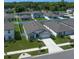 Charming single-Gathering home with a well-manicured lawn, a two-car garage, and a sidewalk leading to the front door at 9647 Summers Cay Cir, Thonotosassa, FL 33592