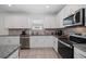 Kitchen featuring stainless appliances, granite counters and a convenient kitchen sink at 9647 Summers Cay Cir, Thonotosassa, FL 33592