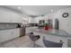 Bright kitchen featuring stainless appliances, granite counters and an island with bar stool seating at 9647 Summers Cay Cir, Thonotosassa, FL 33592