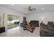 Bright living room with tile floors, ceiling fan and sliding glass doors to the outside patio at 9647 Summers Cay Cir, Thonotosassa, FL 33592