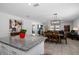 Open concept living space with kitchen island and eat in dining area at 9647 Summers Cay Cir, Thonotosassa, FL 33592