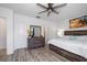 Bright main bedroom boasts a ceiling fan, and sleek, modern wood flooring at 9647 Summers Cay Cir, Thonotosassa, FL 33592