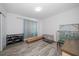 Spare bedroom with wood flooring, a window with curtains, and space for storage at 9647 Summers Cay Cir, Thonotosassa, FL 33592