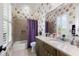 Bathroom with a single vanity, quartz countertop, and a shower with a purple curtain at 18258 Wayne Rd, Odessa, FL 33556
