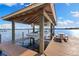Covered boat lift on a picturesque lake, offering convenient boat storage and access at 18258 Wayne Rd, Odessa, FL 33556