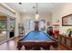 Game room with pool table, access to lanai, and an entertainment center at 18258 Wayne Rd, Odessa, FL 33556