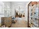 Elegant hallway featuring tile floors, a display case, and a view into the dining room at 18258 Wayne Rd, Odessa, FL 33556