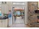 Kitchen with stone fireplace, access to outdoor living, and lake views at 18258 Wayne Rd, Odessa, FL 33556