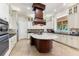 Gourmet kitchen with tile flooring, large island, custom cabinets and stainless steel appliances at 18258 Wayne Rd, Odessa, FL 33556