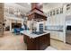 Gourmet kitchen with tile flooring, large island, custom cabinets and stainless steel appliances at 18258 Wayne Rd, Odessa, FL 33556