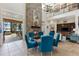 Living room with stone fireplace, lake views and tile flooring at 18258 Wayne Rd, Odessa, FL 33556