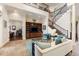 Open-concept living room with staircase, built-in media center, and elegant furnishings at 18258 Wayne Rd, Odessa, FL 33556