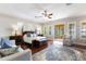 Spacious main bedroom with a sitting area, wood floors, and balcony access at 18258 Wayne Rd, Odessa, FL 33556