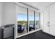 Balcony with comfortable outdoor seating provides panoramic views of the city skyline at 100 Oakmont Ln # 802, Belleair, FL 33756