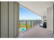 Relax on this condo balcony and enjoy the beautiful view of the water, pool, and surrounding cityscape at 100 Oakmont Ln # 802, Belleair, FL 33756