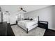 Bright bedroom featuring a king bed, fan, and modern furnishings at 100 Oakmont Ln # 802, Belleair, FL 33756