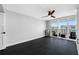 This bedroom offers smooth hardwood floors and balcony access with views of the city at 100 Oakmont Ln # 802, Belleair, FL 33756