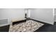 Open hallway with black hardwood floors and a decorative rug at 100 Oakmont Ln # 802, Belleair, FL 33756