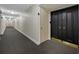 Hallway featuring neutral-toned walls and wall-to-wall carpet at 100 Oakmont Ln # 802, Belleair, FL 33756