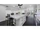 Bright open kitchen featuring a quartz island, modern fixtures, and lots of room for seating at 100 Oakmont Ln # 802, Belleair, FL 33756