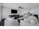 Comfortable living room showcasing a ceiling fan, open layout, and stylish, modern furnishings at 100 Oakmont Ln # 802, Belleair, FL 33756