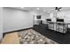 Open-concept living room features a breakfast bar that opens up to the kitchen at 100 Oakmont Ln # 802, Belleair, FL 33756