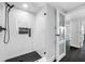 Clean modern shower featuring glass enclosure, black hardware and fixtures, and tiled walls at 100 Oakmont Ln # 802, Belleair, FL 33756