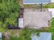 An aerial view shows the layout of the fenced backyard at 105 1St Se Ave, Lutz, FL 33549