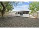 The home features a spacious backyard with a screened porch at 105 1St Se Ave, Lutz, FL 33549