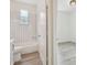 Well-lit bathroom featuring black and white checkered tiles and modern fixtures at 105 1St Se Ave, Lutz, FL 33549