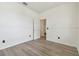 An airy room features light-colored floors and a doorway leading to another room at 105 1St Se Ave, Lutz, FL 33549
