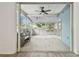 The spacious screened porch includes a ceiling fan and plenty of room for a grill at 105 1St Se Ave, Lutz, FL 33549