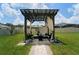 Landscaped backyard with outdoor seating area at 10826 Trailing Vine Dr, Tampa, FL 33610